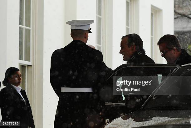 Former President George H.W. Bush and his son former Florida Governor Jeb Bush move to enter the West Wing of the White House to meet with U.S....