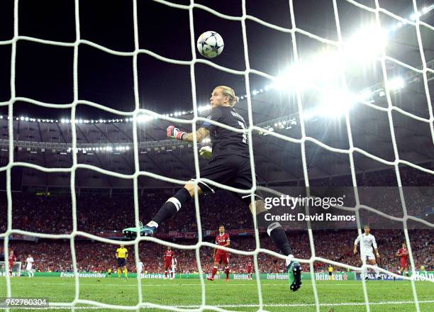 Loris Karius of Liverpool watches the ball cross the line as he concedes for the third time during the UEFA Champions League Final between Real...