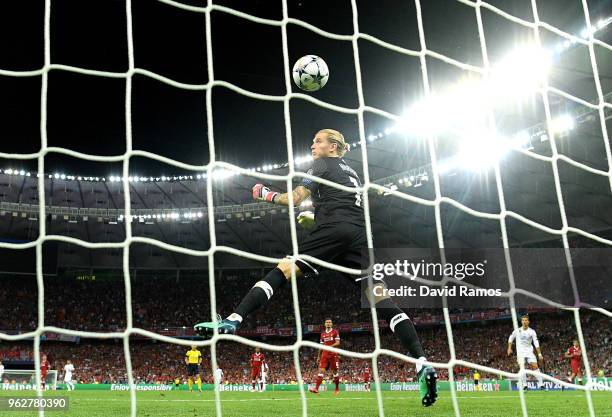 Loris Karius of Liverpool watches the ball cross the line as he concedes for the third time during the UEFA Champions League Final between Real...