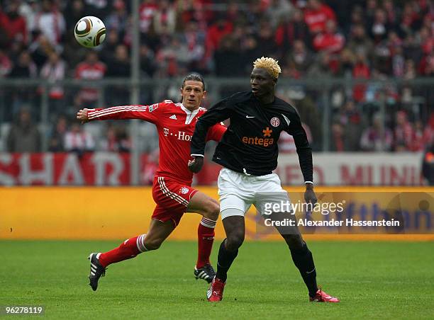 Martin Demichelis of Muenchen battles for the ball with Aristide Bance of Mainz during the Bundesliga match between FC Bayern Muenchen and FSV Mainz...