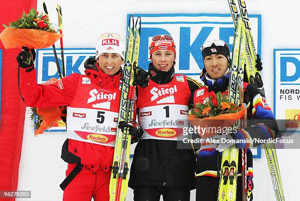 Mario Stecher of Austria , Eric Frenzel of Germany and Akito Watabe celebrate on the podium after the Gundersen 10km Cross Country event during day...