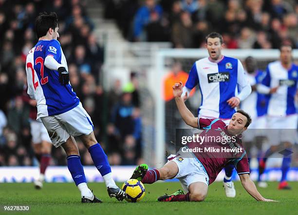 Mark Noble of West Ham United challenges Nikola Kalinic of Blackburn Rovers during the Barclays Premier League match between West Ham United and...