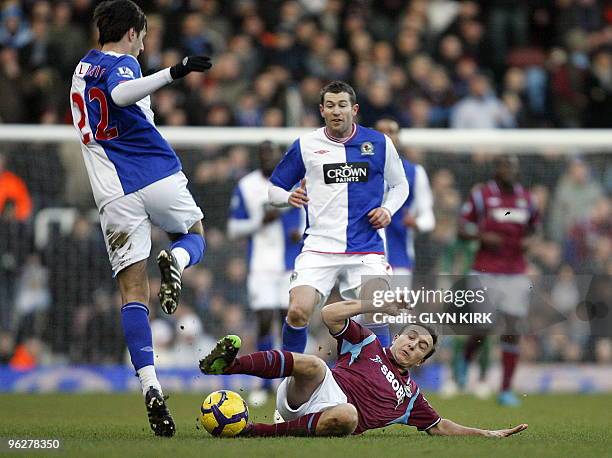 West Ham's English midfielder Mark Noble vies with Blackburn's Croatian striker Nikola Kalinic during the English Premier League football match...