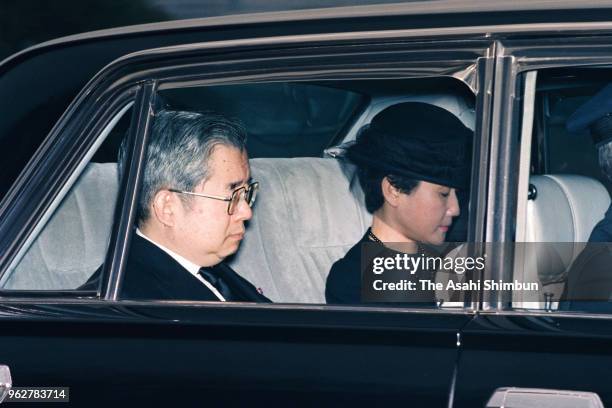 Prince Hitachi and Princess Hanako of Hitachi are seen on departure at the Imperial Palace after Emperor Hirohito died of cancer on January 7, 1989...