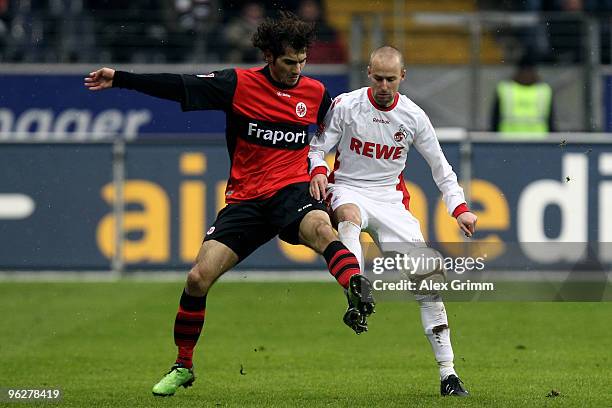 Halil Altintop of Frankfurt is challenged by Miso Brecko of Koeln during the Bundesliga match between Eintracht Frankfurt and 1. FC Koeln at the...