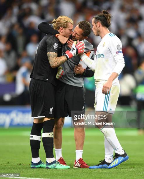 Loris Karius of Liverpool is consoled by Gareth Bale of Real Madrid following the UEFA Champions League Final between Real Madrid and Liverpool at...