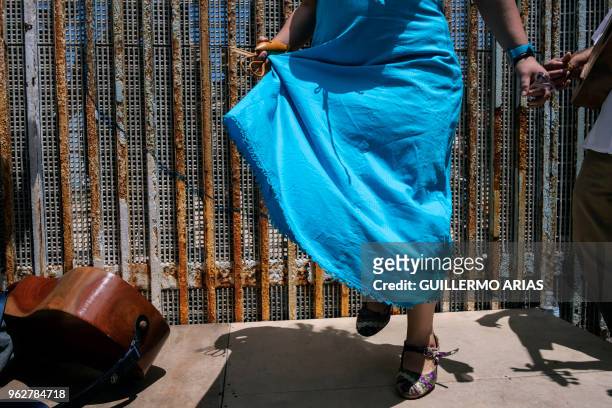 Dancer performs during the annual "Fandango Fronterizo" event, at the Friendship Park on the US/Mexico border in Playas de Tijuana, Baja California...