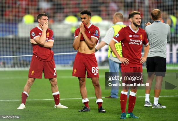 James Milner of Liverpool and Trent Alexander-Arnold of Liverpool look dejected following their sides defeat in the UEFA Champions League Final...