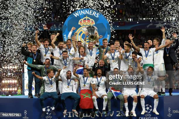 Real Madrid's Spanish defender Sergio Ramos holds the trophy after winning the UEFA Champions League final football match between Liverpool and Real...