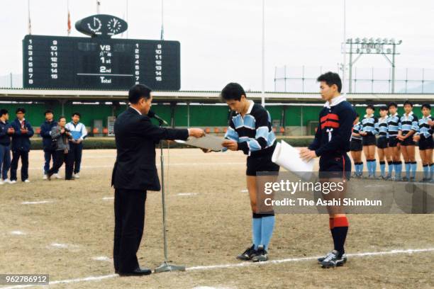 Captains receive certificates as the All Japan High School Rugby Championship final between Osaka Institute of Technology and Meikei Gakuen was...