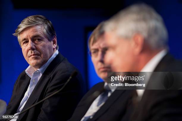 Josef Ackermann, chief executive officer of Deutsche Bank AG, left, participates in a panel discussion on day three of the 2010 World Economic Forum...