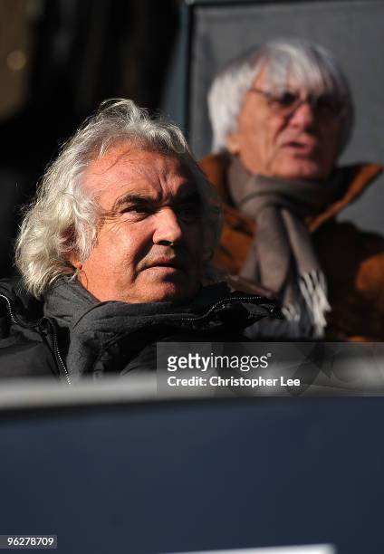 Flavio Briatore and Bernie Ecclestone of QPR look on before kick off in the Coca-Cola Championship match between Queens Park Rangers and Scunthorpe...