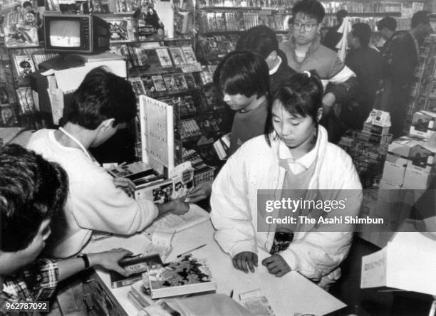 Customers queue at a video rental store after Emperor Hirohito died of cancer on January 7, 1989 in Nishinomiya, Hyogo, Japan.