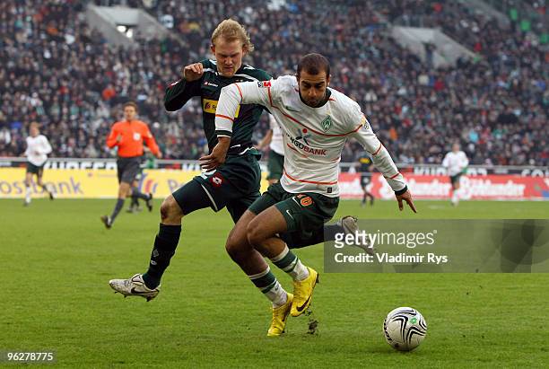 Tobias Levels of Moenchengladbach defends Aymen Abdennour of Bremen during the Bundesliga match between Borussia Moenchengladbach and SV Werder...