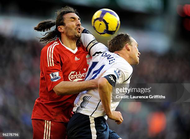 Kevin Davies of Bolton battles with Sotirios Kyrgiakos of Liverpool during the Barclays Premier League match between Liverpool and Bolton Wanderers...