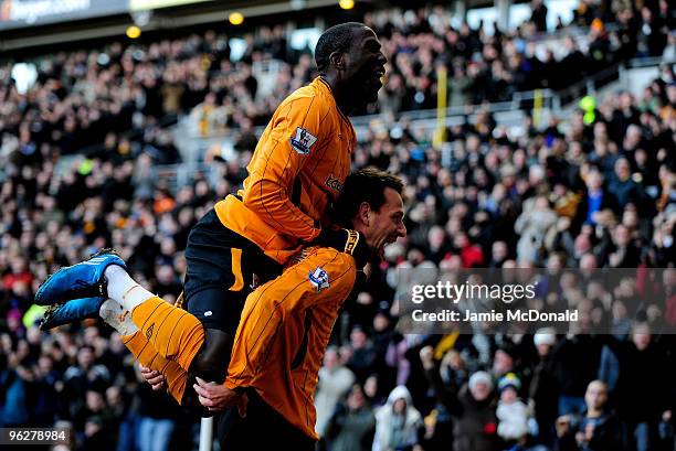 Jan Vennegoor of Hesselink of Hull City celebrates his goal with Jozy Altidore during the Barclays Premier League match between Hull City and...