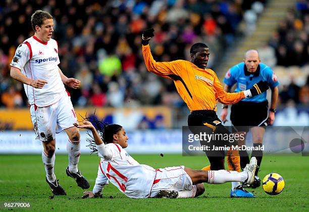 Jozy Altidore of Hull City battles with Michael Mancienne of Wolves during the Barclays Premier League match between Hull City and Wolverhampton...