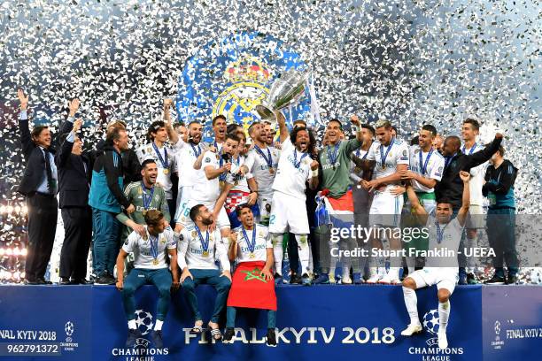 Marcelo of Real Madrid lifts The UEFA Champions League trophy following their side's victory in the UEFA Champions League Final between Real Madrid...