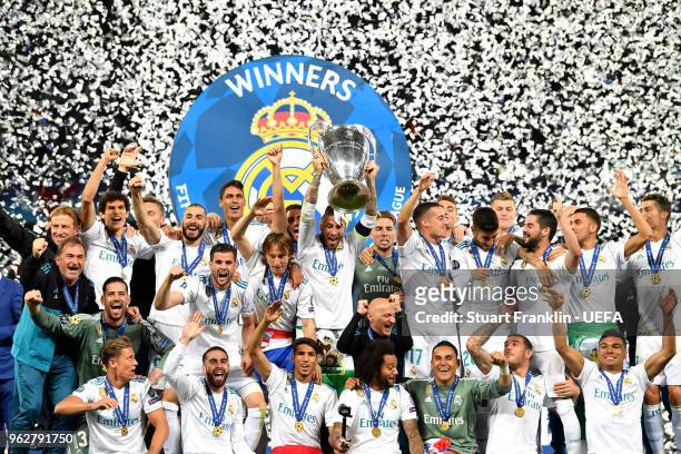 Sergio Ramos of Real Madrid lifts The UEFA Champions League trophy following their side's victory in the UEFA Champions League Final between Real...
