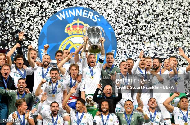 Sergio Ramos of Real Madrid lifts The UEFA Champions League trophy following their side's victory in the UEFA Champions League Final between Real...