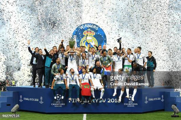 Nacho Fernandez of Real Madrid lifts The UEFA Champions League trophy following their side's victory in the UEFA Champions League Final between Real...