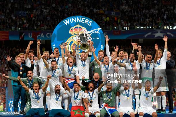 Real Madrid's Spanish defender Sergio Ramos holds the trophy after winning the UEFA Champions League final football match between Liverpool and Real...