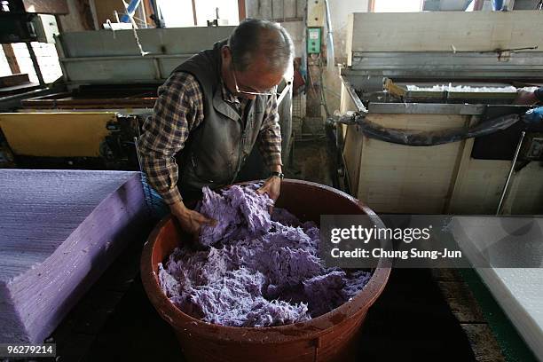 South Korean man makes 'Hanji', a traditional Korean paper at his factory on January 30, 2010 in Jeonju, South Korea. Hanji is a traditional Korean...