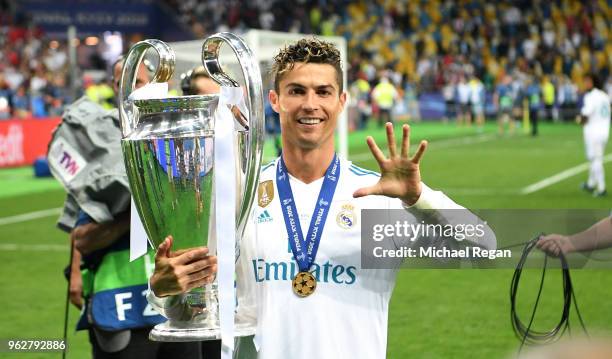 Cristiano Ronaldo of Real Madrid lifts The UEFA Champions League trophy following his sides victory in during the UEFA Champions League Final between...