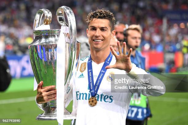 Cristiano Ronaldo of Real Madrid lifts The UEFA Champions League trophy following his sides victory in during the UEFA Champions League Final between...