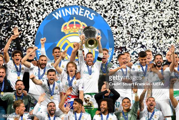 Sergio Ramos of Real Madrid lifts The UEFA Champions League trophy following his sides victory in the UEFA Champions League Final between Real Madrid...