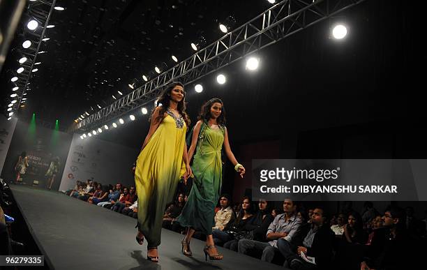 Indian models walk the ramp in creations by designer Babita Malkani during the third day of Bangalore Fashion Week on January 30, 2010. Thirty...