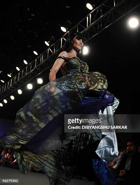 Indian Bollywood actor Koena Mitra walk the runway in a creation by designer Babita Malkani during the third day of Bangalore Fashion Week on January...