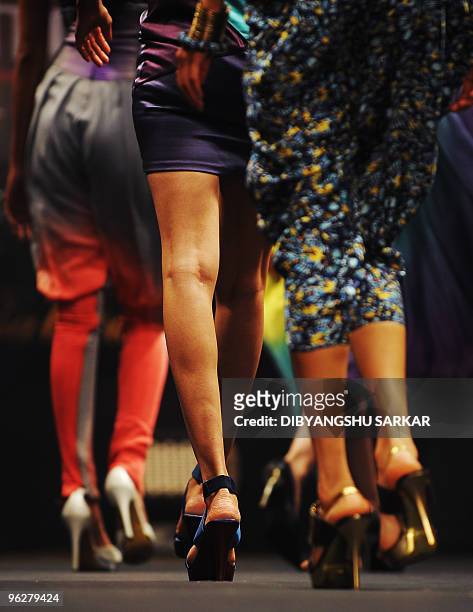 Indian models walk the ramp in creations by designer Babita Malkani during the third day of Bangalore Fashion Week on January 30, 2010. Thirty...