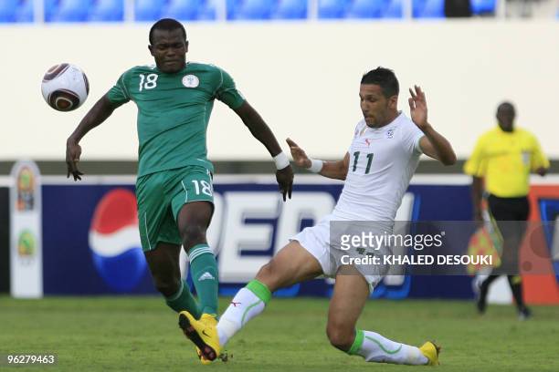 Slimane Raho of Algeria fights for the ball with with Obinna Nsofor of Nigeria during their third-place playoff match of the Africa Cup of Nations at...