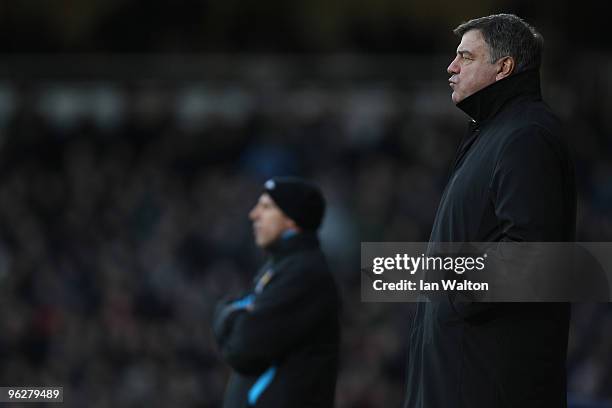 Sam Allardyce, Manager of Blackburn Rovers looks on with Gianfranco Zola, Manager of West Ham United during the Barclays Premier League match between...