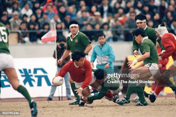 Kazuhira Onishi of Kobe Steel is tackled during the 26th All Japan Rugby Championship match between Kobe Steel and Daito Bunka University at the...