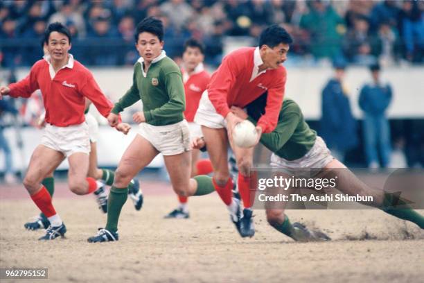 Seiji Hirao of Kobe Steel is tackled during the 26th All Japan Rugby Championship match between Kobe Steel and Daito Bunka University at the National...