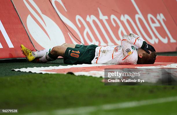 Marko Marin of Bremen lays on a pitch side during the Bundesliga match between Borussia Moenchengladbach and SV Werder Bremen at Borussia Park...