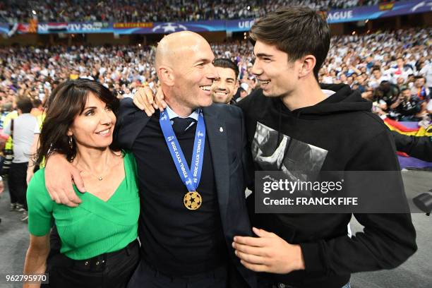 Real Madrid's French coach Zinedine Zidane celebrates with with wife Veronique and son Theo after winning the UEFA Champions League final football...