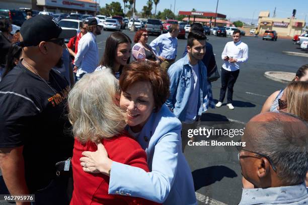 Representative Jacky Rosen, a Democrat from Nevada and Democratic U.S. Senate candidate, center, greets supporters ahead of early voting at Cardenas...