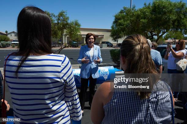 Representative Jacky Rosen, a Democrat from Nevada and Democratic U.S. Senate candidate, center, speaks ahead of early voting at Cardenas Supermarket...