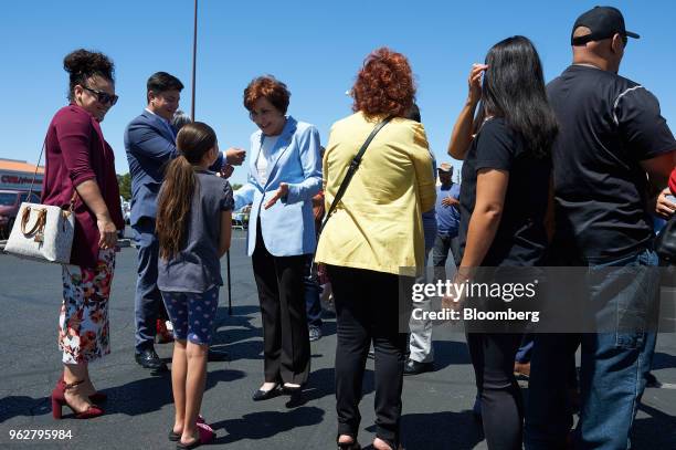Representative Jacky Rosen, a Democrat from Nevada and Democratic U.S. Senate candidate, center left, greets supporters ahead of early voting at...