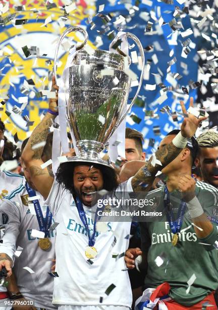 Marcelo of Real Madrid lifts The UEFA Champions League trophy following their sides victory in the UEFA Champions League Final between Real Madrid...