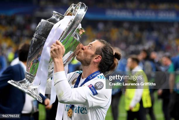 Gareth Bale of Real Madrid celebrates with The UEFA Champions League trophy following his sides victory in the UEFA Champions League Final between...