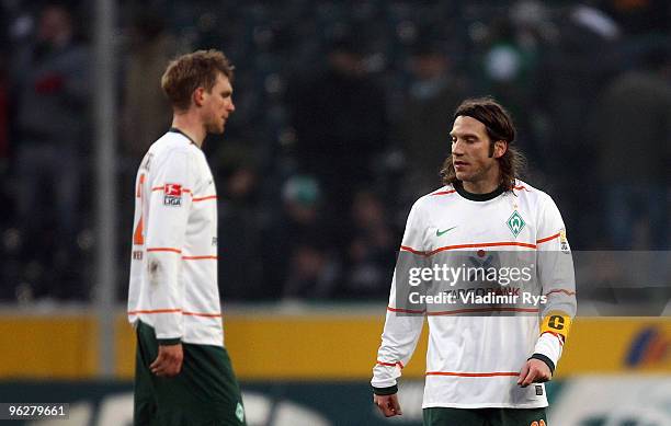 Per Mertesacker and Torsten Frings of Bremen look dejected after losing the Bundesliga match between Borussia Moenchengladbach and SV Werder Bremen...