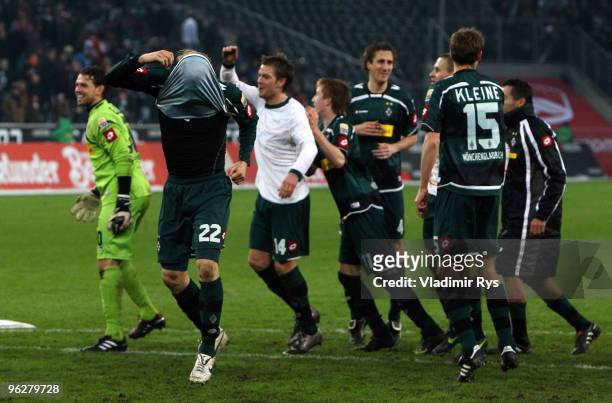 Tobias Levels of Moenchengladbach celebrates with his jersey over his head after winning the Bundesliga match between Borussia Moenchengladbach and...