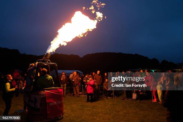 Night glow using hot air balloon burners ignited in time to music takes place during the Durham Hot Air Balloon Festival on May 26, 2018 in Durham,...