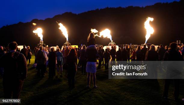 Night glow using hot air balloon burners ignited in time to music takes place during the Durham Hot Air Balloon Festival on May 26, 2018 in Durham,...