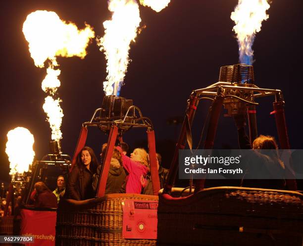 Night glow using hot air balloon burners ignited in time to music takes place during the Durham Hot Air Balloon Festival on May 26, 2018 in Durham,...