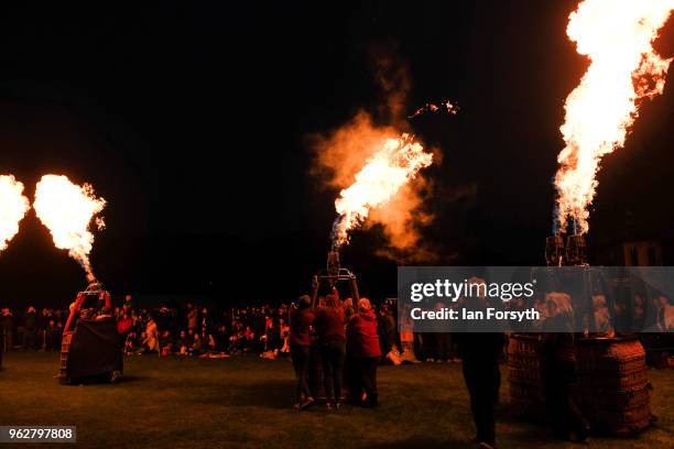 Night glow using hot air balloon burners ignited in time to music takes place during the Durham Hot Air Balloon Festival on May 26, 2018 in Durham,...